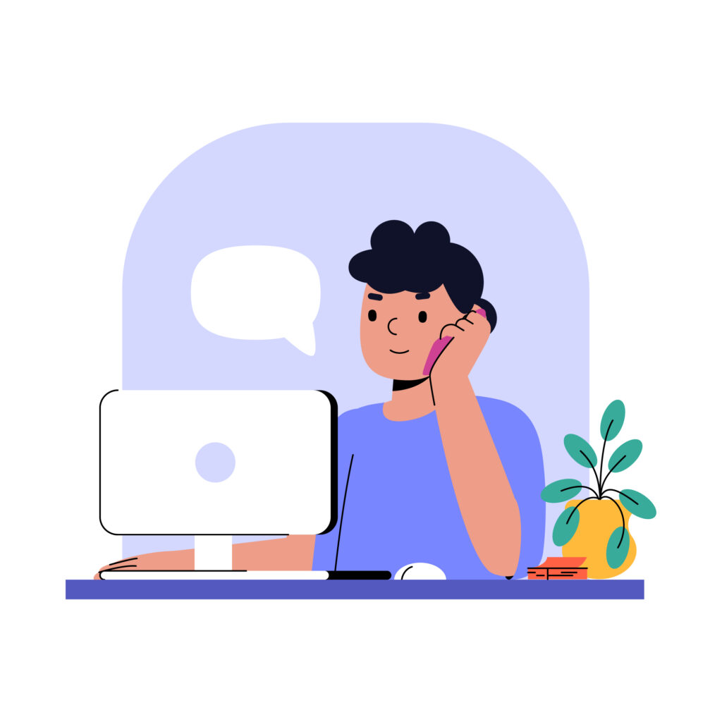 Person talking on phone while at computer desk